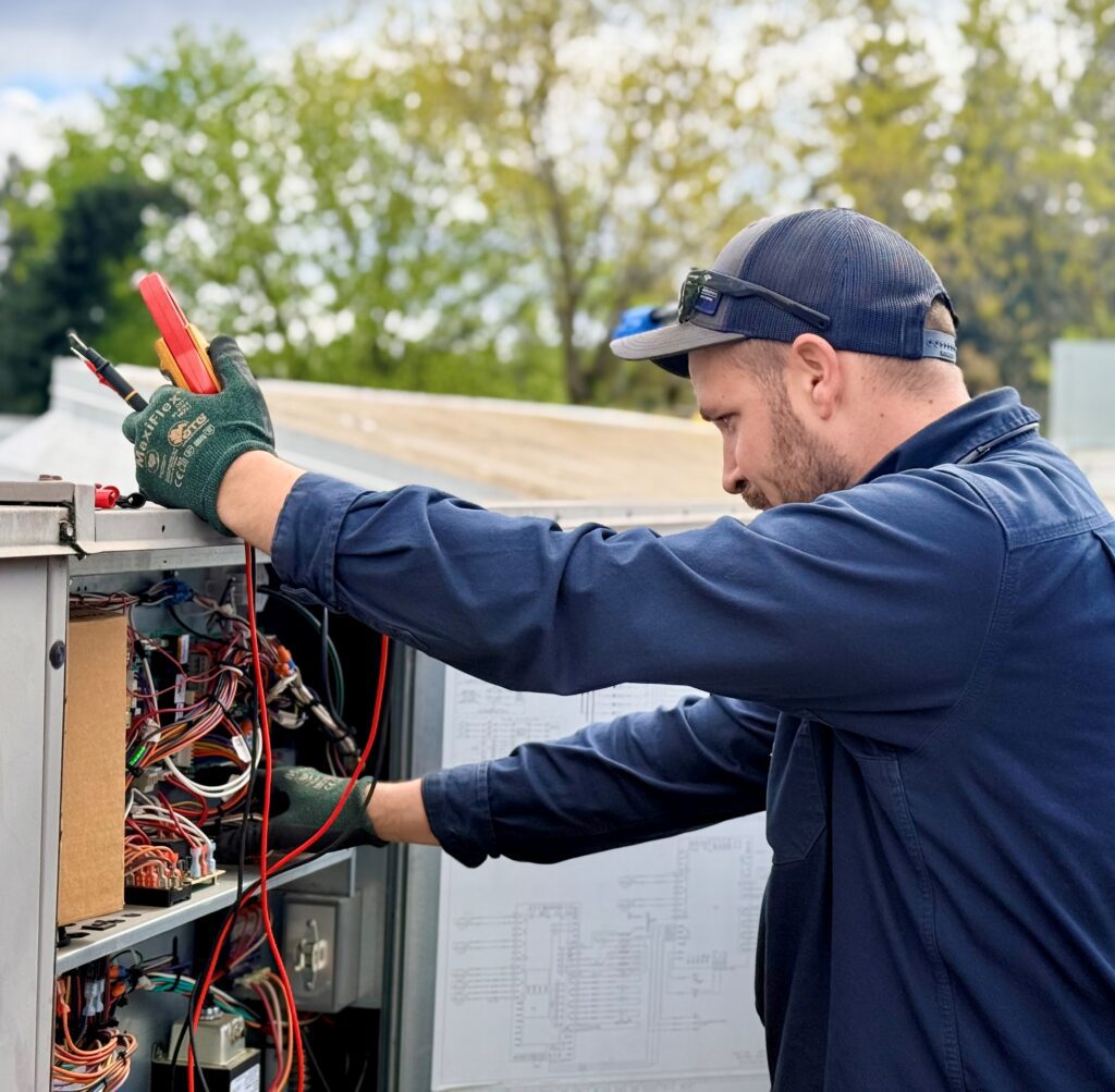 Technician working on HVAC system.